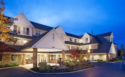 Exterior view of the Wellington assisted living facility at dusk