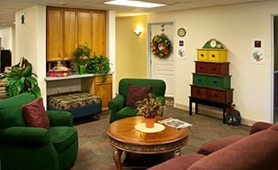 Common area with green seating and decorations