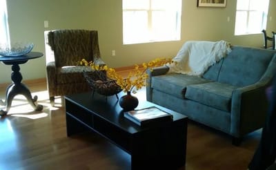 Cozy living area with chairs and decorative flowers