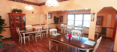 Dining room with tables and chairs set for meals