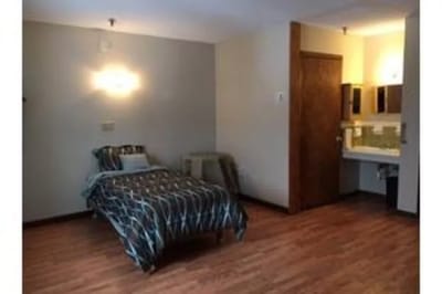 Interior view of a resident's room with simple decor