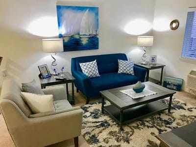 Cozy interior with a blue sofa and artwork