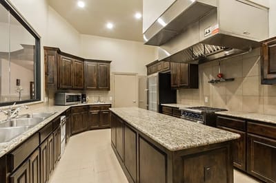 Well-equipped kitchen space with wooden cabinetry