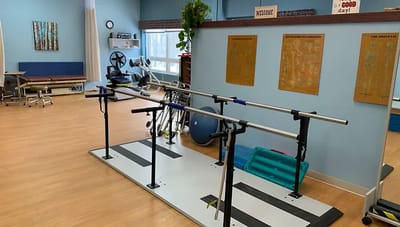 Rehabilitation space with therapy equipment and parallel bars