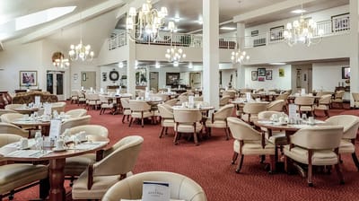 Dining room with tables set for a meal
