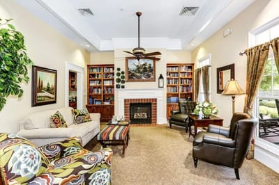 Cozy lounge area with bookshelves and seating