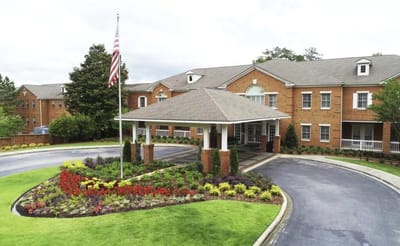 Exterior view of Galleria Woods with landscaped entrance