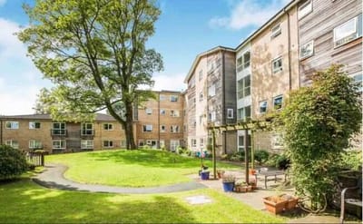 Outdoor view of a retirement apartment complex with landscaping