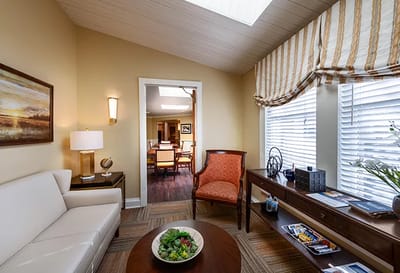 Bright common area with seating and natural light
