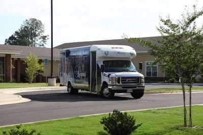 Facility transport vehicle parked outside