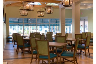 Bright dining area with tables and chairs