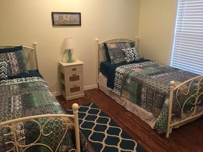 Two twin beds in a cozy shared resident room