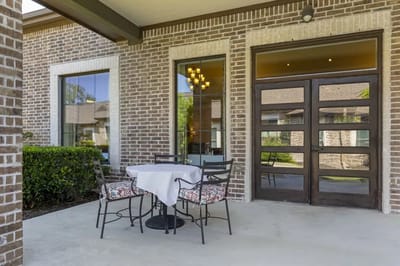 Outdoor patio area with seating and table