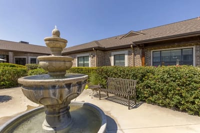 Outdoor space with a fountain and seating area