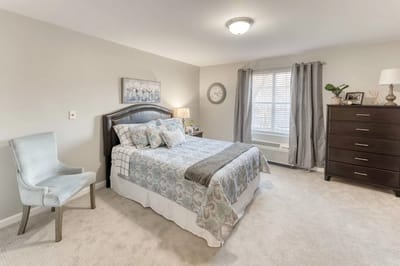 Cozy private resident room with a bed and decor