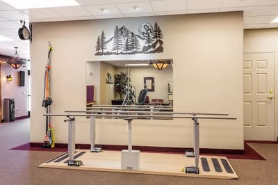 Rehabilitation area with parallel bars and mirrors