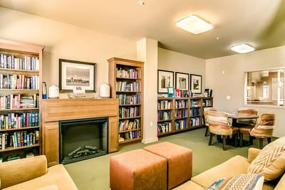 Common area with bookshelves and seating