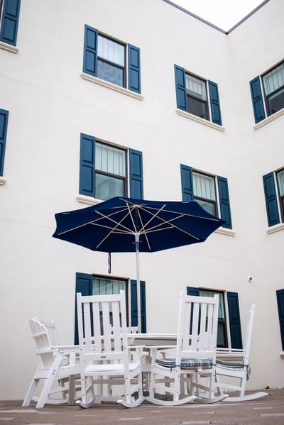 Outdoor seating area with tables and chairs