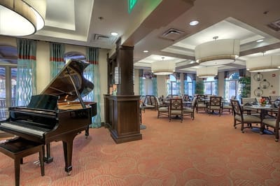 Bright common area with piano and seating