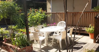 Outdoor seating area with a table and chairs