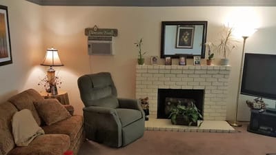 Cozy living room interior with a fireplace and seating