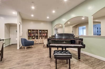 Cozy common area with a piano and seating