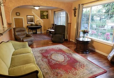Cozy common area with comfortable seating and a view of the garden