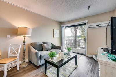 Cozy living room with sofa and balcony view