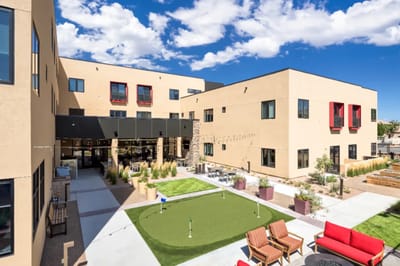 Outdoor space with seating and putting green