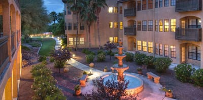 Outdoor courtyard with fountain and walking paths