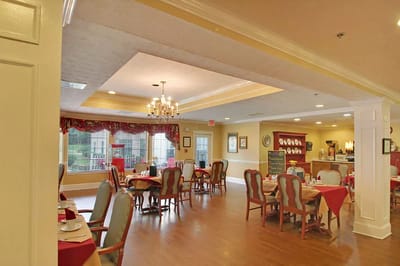 Dining area with tables and chairs set for a meal