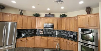 Modern kitchen with wooden cabinetry and appliances