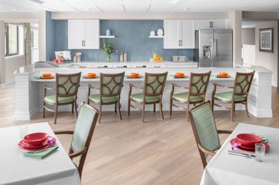 Bright dining area with modern kitchen and seating
