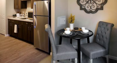 Cozy kitchen and dining area in a resident room