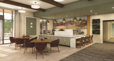 Bright common area with dining tables and modern decor