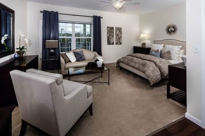 Well-furnished private room in a senior living facility