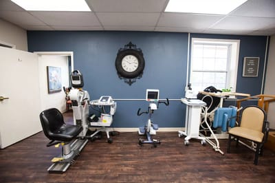 Interior view of a therapy room with exercise equipment