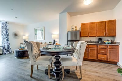 A cozy dining area in a residential suite