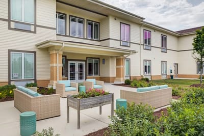 Outdoor seating area with green landscaping