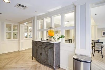 Bright interior area with a decorative table and juice