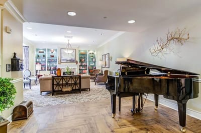 Common area with a piano and seating