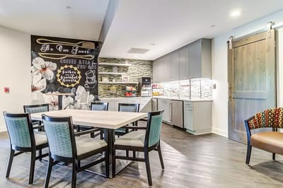Common area with a coffee station and seating