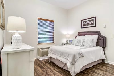 Cozy interior of a private resident room with a bed