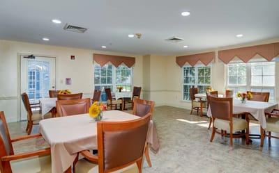 Bright dining room with sunflowers on tables