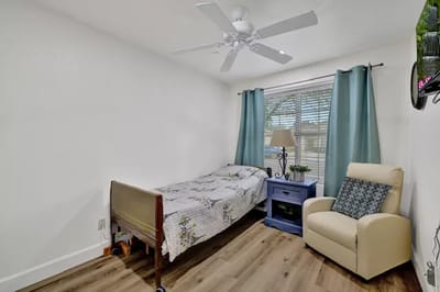 Cozy private resident room with bed and chair