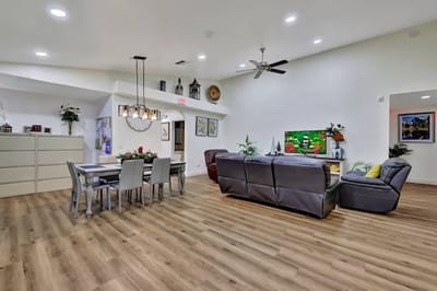 Bright common area with seating and dining space