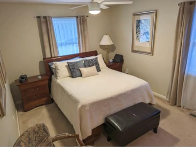 Cozy private resident room with bed and furnishings