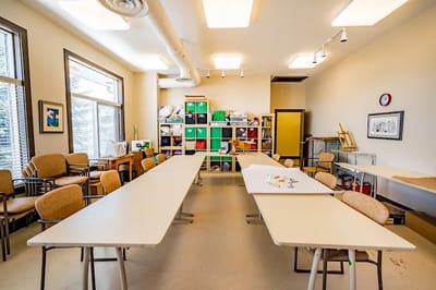 Bright common area with tables and chairs