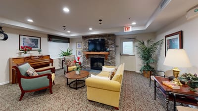 Cozy common area with seating and a fireplace