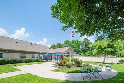 Outdoor view of the facility with garden and seating